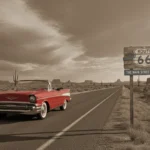 Route 66 Centennial: Lasting Cultural Significance & Preservation Classic car on historic Route 66 under a vast sky, symbolizing American road trip culture.